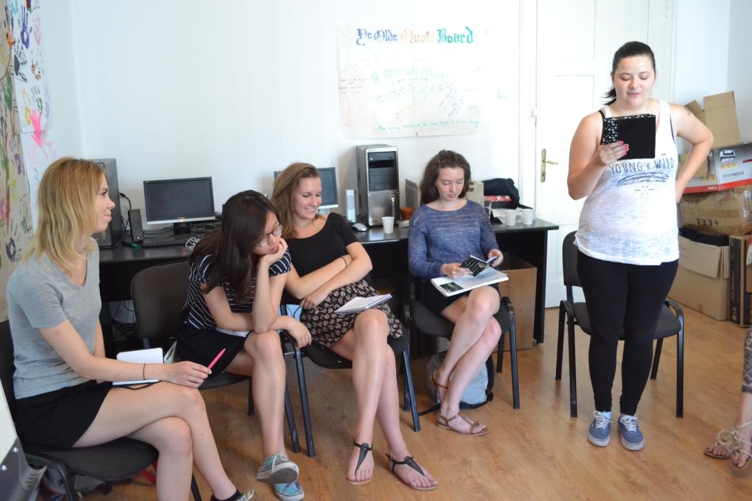 Teenage volunteers work as a group to find the best stories for the magazine Journalism volunteers discuss their story ideas as part of their Journalism Project for teenagers
